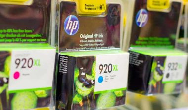 Close up of HP ink cartridges for sale in a store, representing the HP monopoly class action.