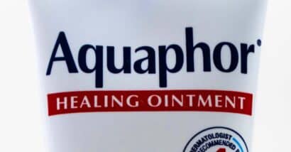 Close up of Aquaphor logo, representing the Aquaphor lip repair class action.