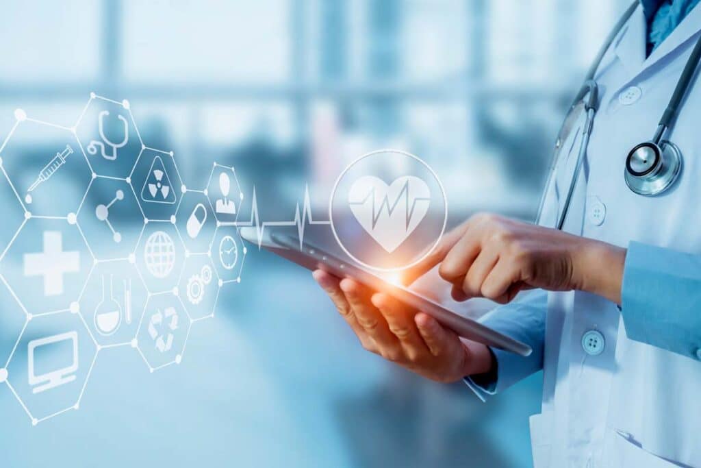 Close up of a doctor using a tablet with a patient data concept overlay, representing the Medical Healthcare Solutions class action lawsuit settlement.