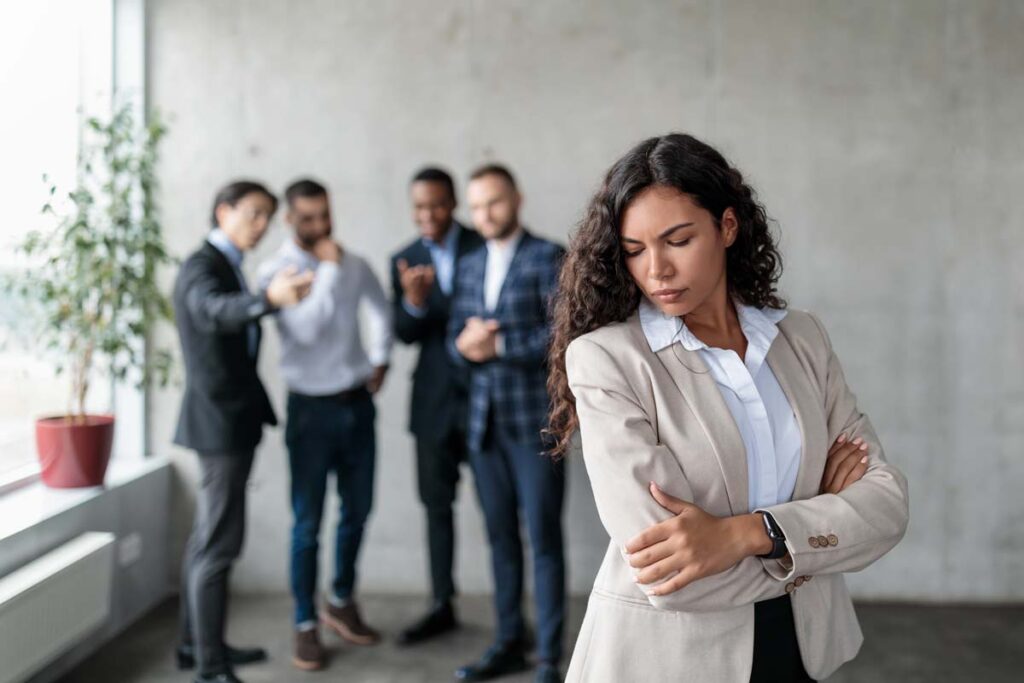A woman experiencing discrimination in the workplace, representing recent discrimination class action lawsuits.
