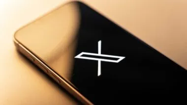 Close up of X Corp logo displayed on a smartphone screen, representing the X class action lawsuit.