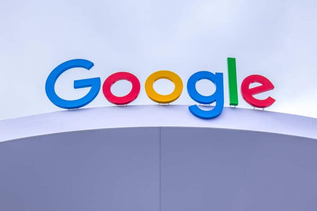 Close up of Google signage atop a building, representing the Google patent infringement settlement.