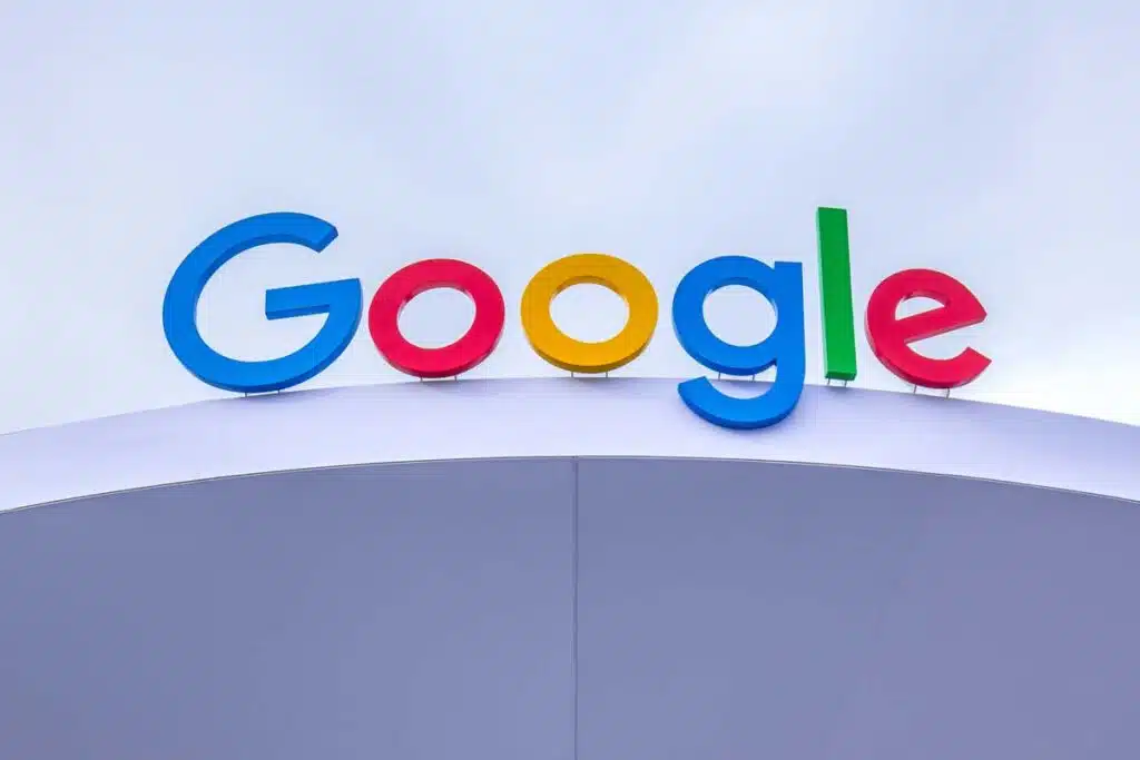 Close up of Google signage atop a building, representing the Google patent infringement settlement.