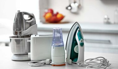 Household products on a kitchen counter (iron, blender, etc), representing recent recalls on household products.