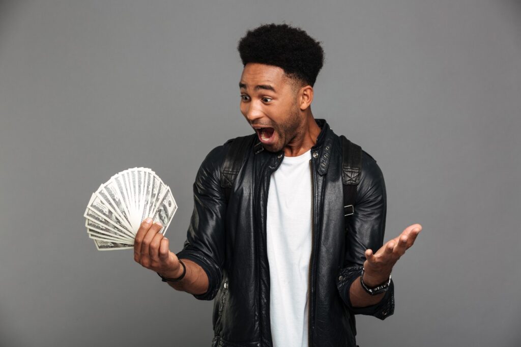 Man excited with cash in hand.