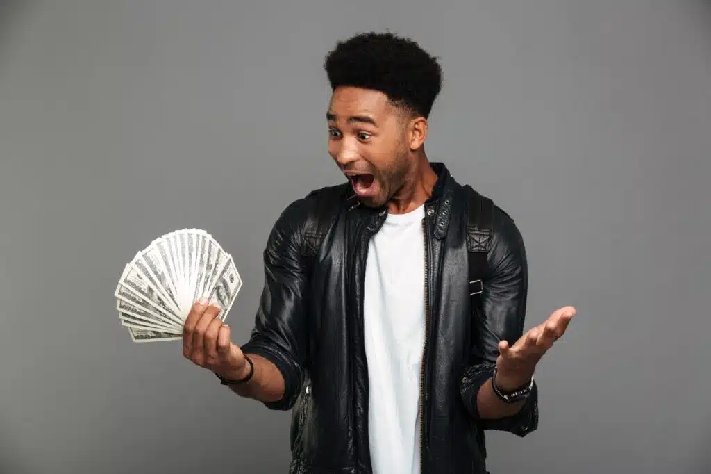 Man excited with cash in hand.