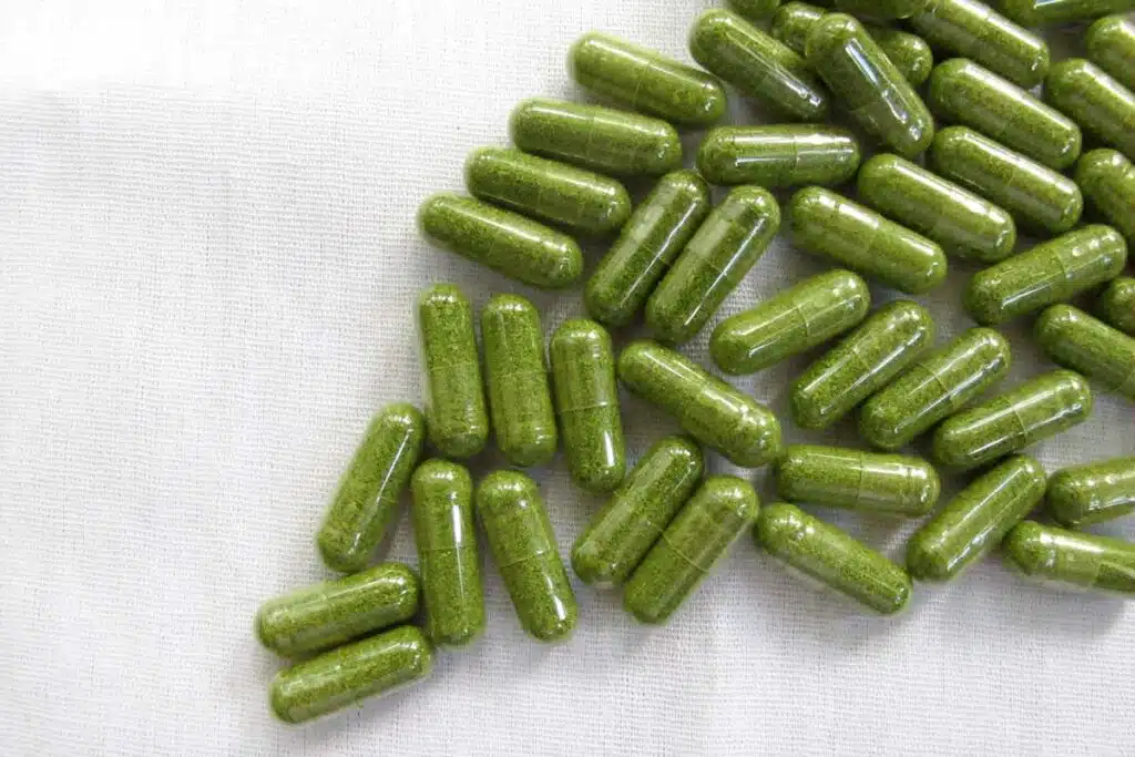 Close up of green capsules, representing the Balance of Nature class action lawsuit.