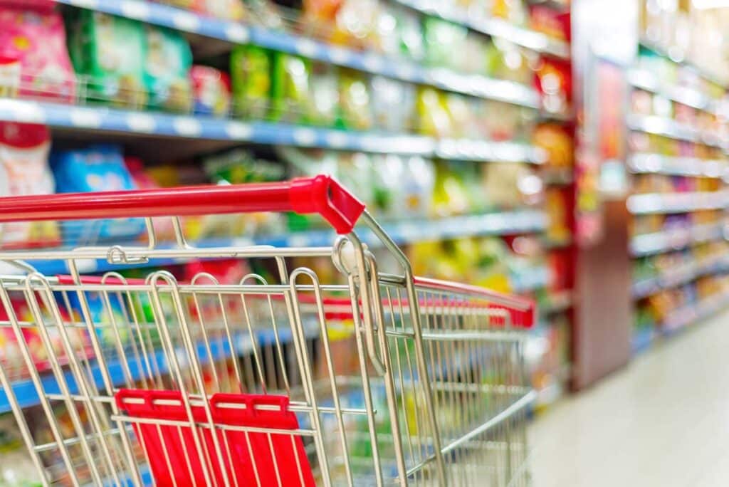 Close up of a shopping cart inside of a supermarket, representing top recalls for the week of Feb. 19.