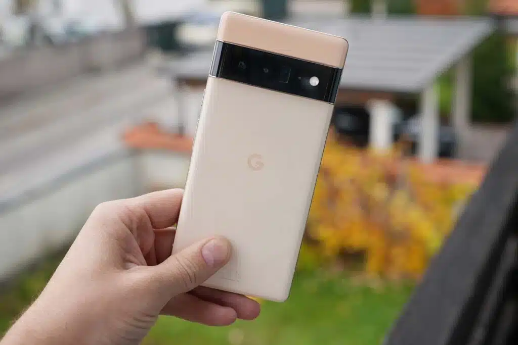 Close up of a hand holding a Google Pixel Pro 6, representing the Google Pixel class action.