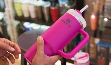 Close up of a woman holding a pink Stanley cup, representing the Stanley cups lead class actions.