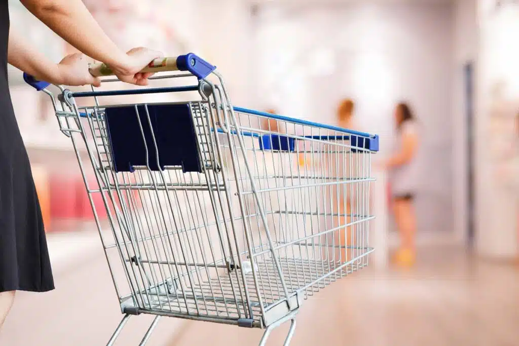 Close up of a woman pushing a shopping cart, representing top recalls for the week of Feb. 5.