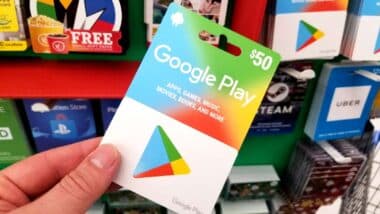 Close of a hand holding a Google Play Store gift card, representing the Google gift card class action.