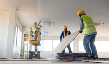 Construction workers installing dry wall, representing the Maryland Applicators settlement.