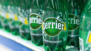 Close up of Perrier water bottles on a supermarket shelf, representing the Perrier class action.