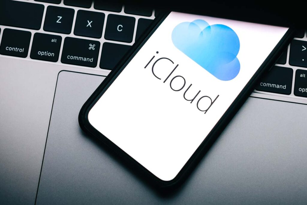 Close up of iCloud logo displayed on a smartphone screen, representing the Apple class action.
