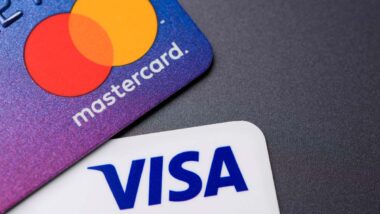 Close up of Visa and Mastercard logo on credit cards, representing the Visa and Mastercard settlement.