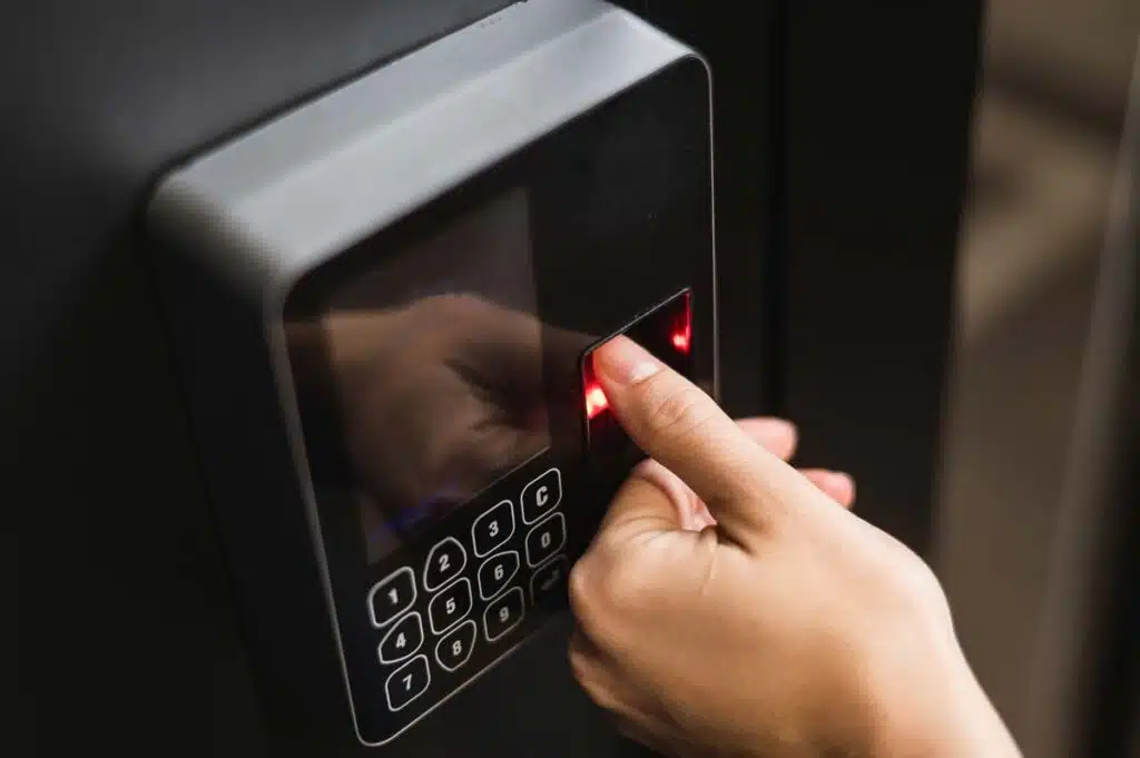 Close up of a woman using a fingerprint time clock, representing the Graphic Packaging International BIPA settlement.
