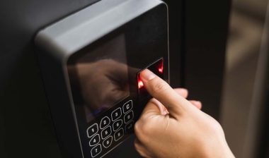 Close up of a woman using a fingerprint time clock, representing the Graphic Packaging International BIPA settlement.