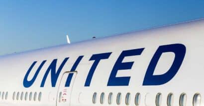 Close up of United logo on the side of an airplane, representing the United Airlines class action.