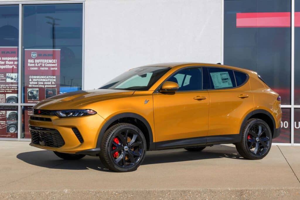 A gold Dodge Hornet on display at a dealership, representing the Dodge Hornets and Alfa Romeo Tonales recall.