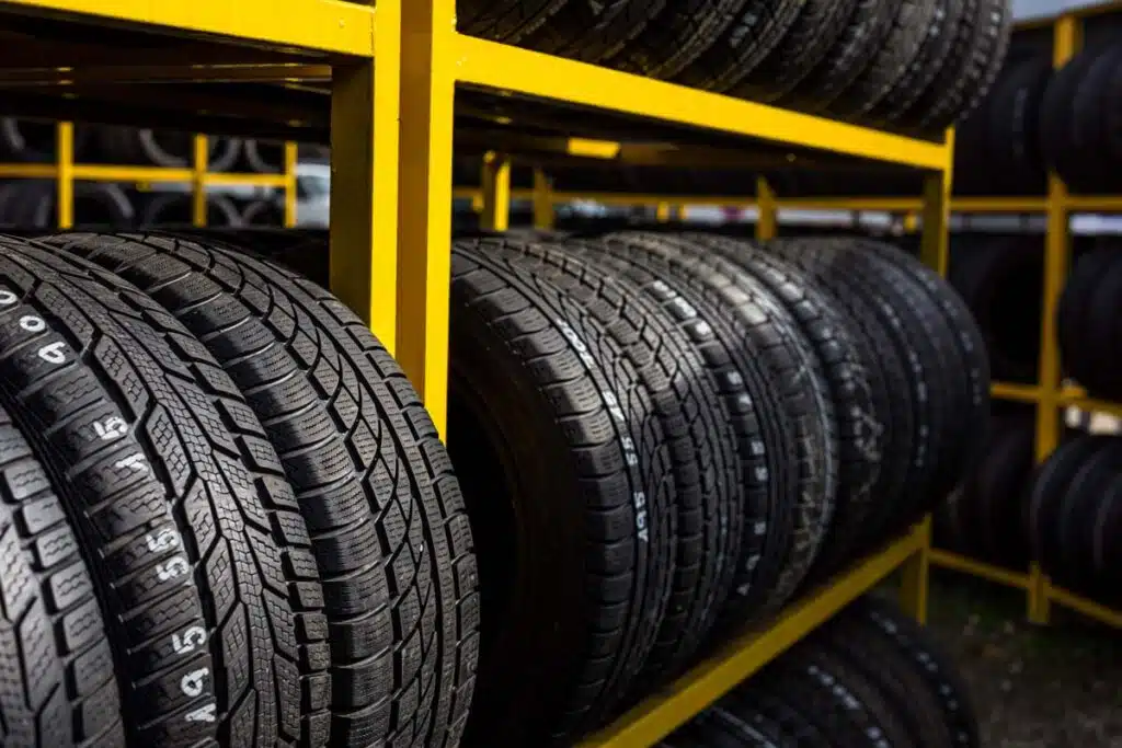 Close up of tires for sale in a tire shop, representing the tire price-fixing class action.