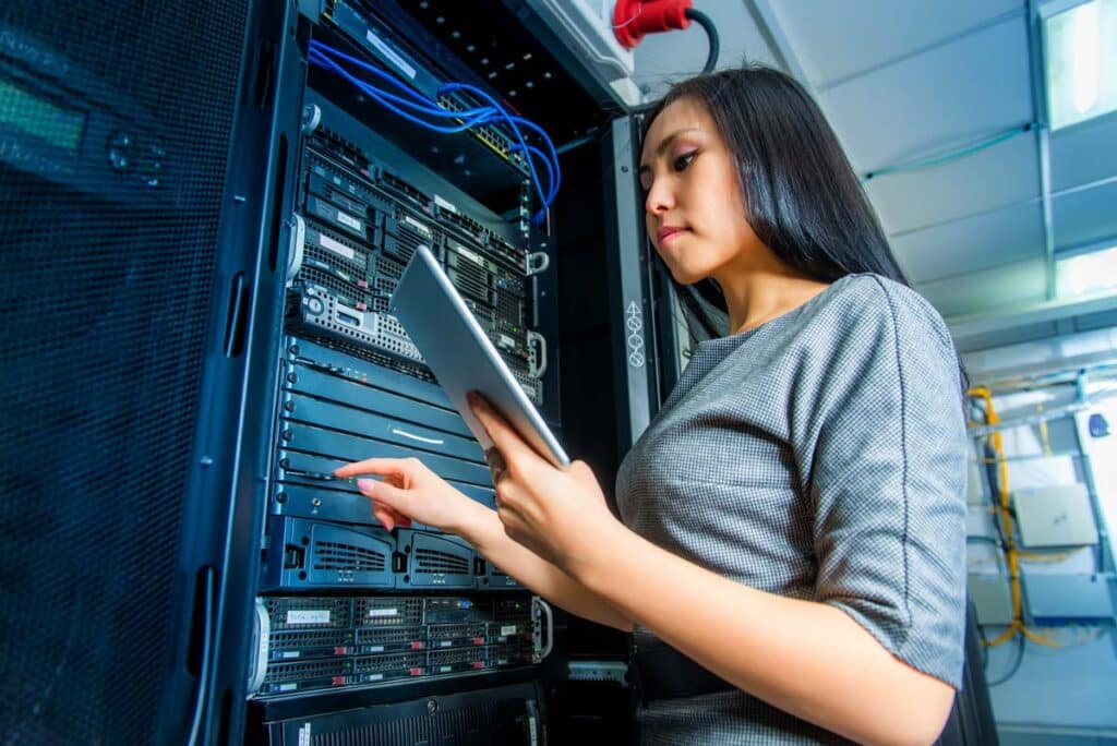 Young IT worker working on a network server, representing the Med-Data settlement.