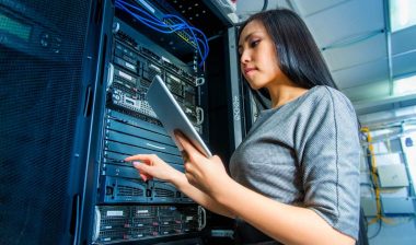 Young IT worker working on a network server, representing the Med-Data settlement.
