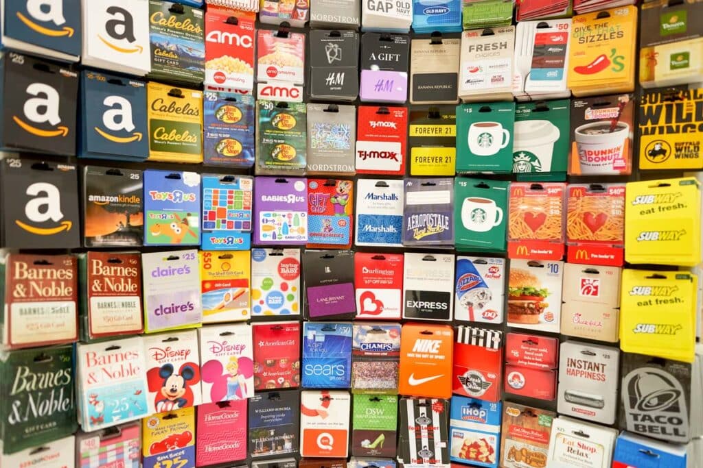 Various gift cards on display at a store, representing the gift cards class actions.