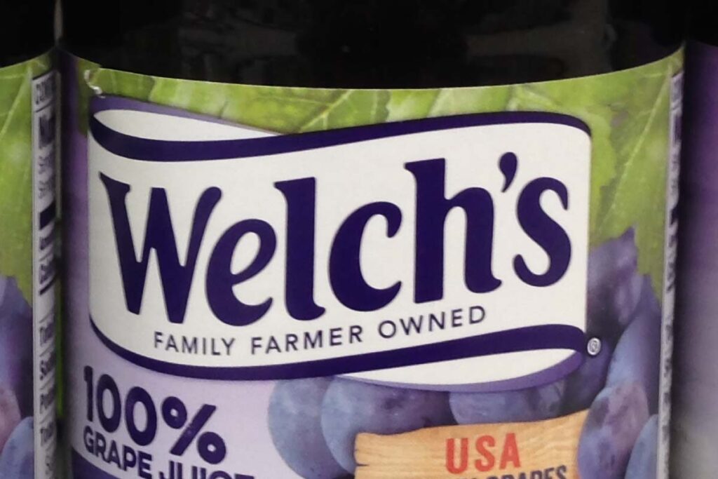 Close up of Welch's logo on a grape juice bottle, representing the Welch’s class action.