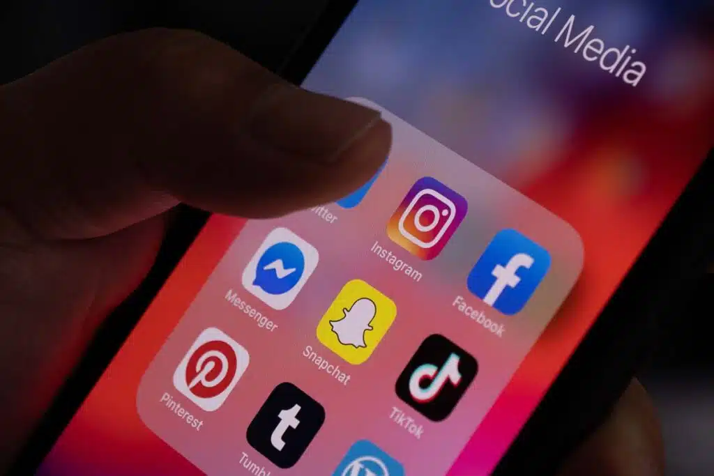 Close up of various social media apps displayed on a smartphone screen, representing the Native Americans social media lawsuit.