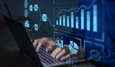Close up of hands typing on a laptop with a data concept overlay, representing the Convergent Outsourcing data breach settlement.