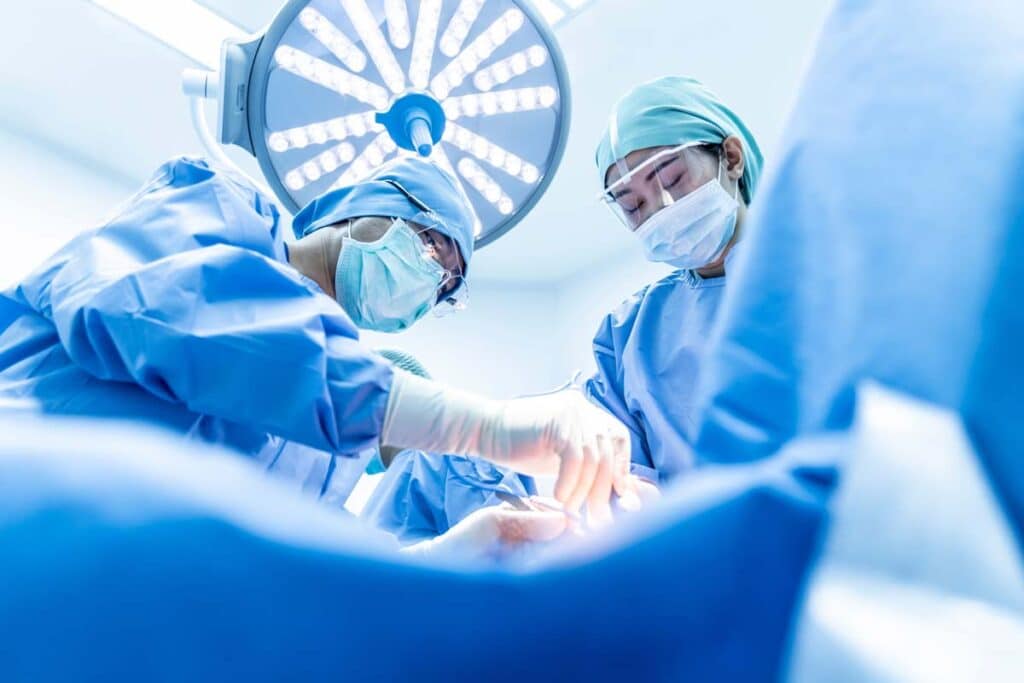 A surgeon and team performing a surgery, representing the Impella heart pump.
