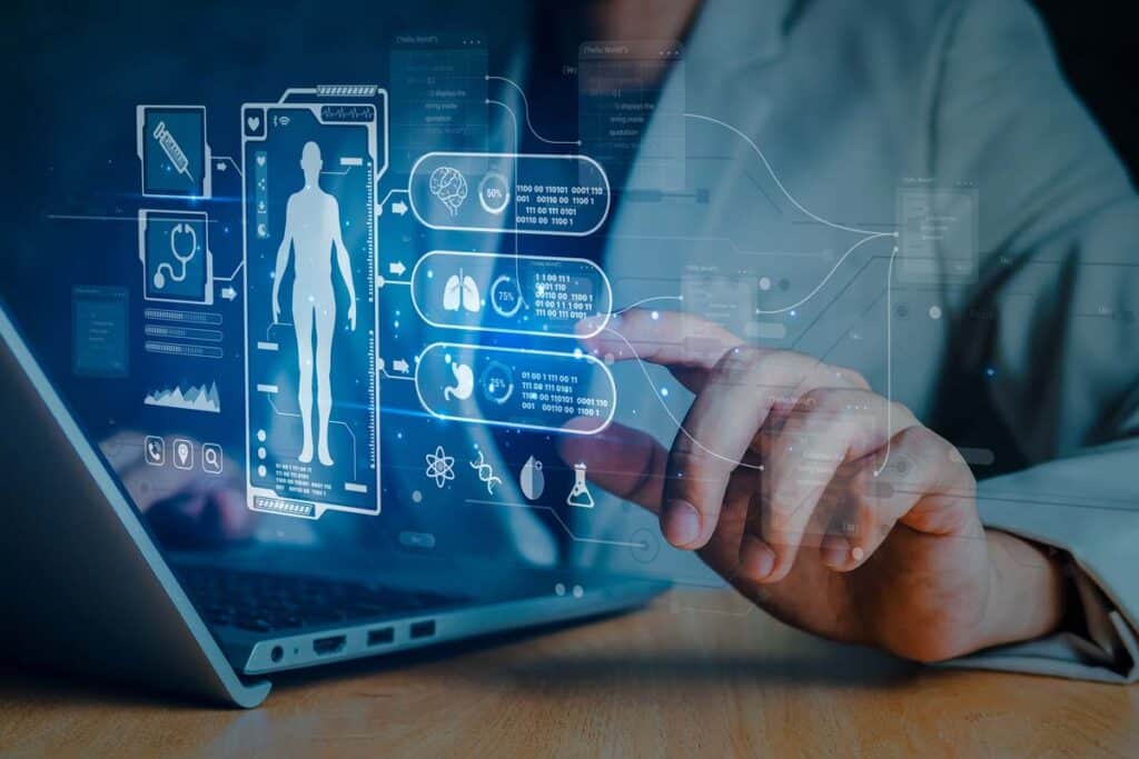 Close up of a doctor using a laptop with a patient data concept overlay, representing the Ernest Health class action.