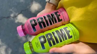 Close up of hands holding Prime Hydration drinks, representing the Prime Hydration class action.