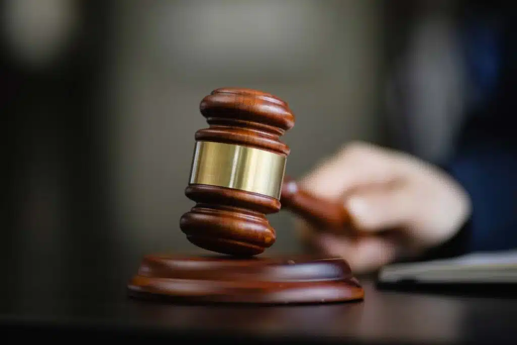 Close up of a judge using a wooden gavel, representing false advertising class actions.