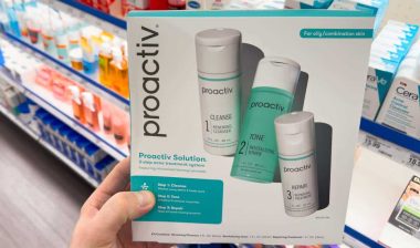 Close up of a woman holding a Proactiv product kit, representing the Proactiv class action.