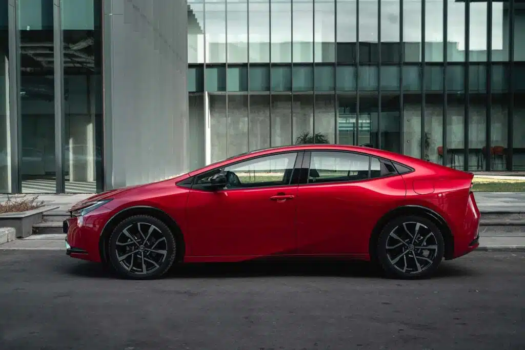 Side view of a red 2024 Toyota Prius Prime, representing the Toyota Prius recall.