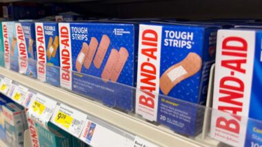 Close up of Johnson & Johnson band aid products on a supermarket shelf, representing the Band-Aid class action.