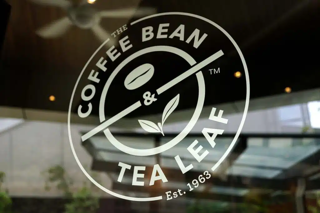 Close up of The Coffee Bean Tea & Leaf window decal, representing the Coffee Bean class action.