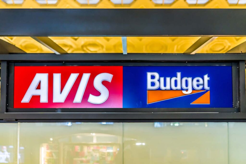 Close up of Avis Budget signage, representing the Avis class action.