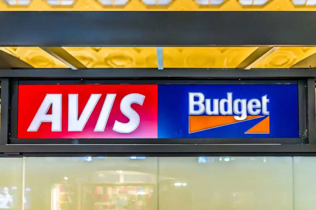Close up of Avis Budget signage, representing the Avis class action.