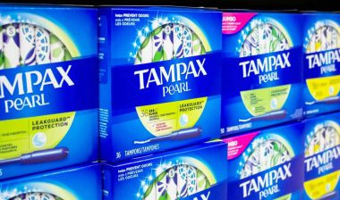 Tampax products on a supermarket shelf, representing the Tampax class action.
