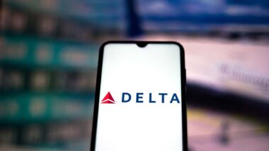 Close up of Delta Airlines logo displayed on a smartphone screen, representing the Delta class action.