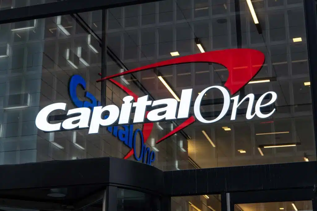 Close up of illuminated Capital One signage at night, representing the Capital One class action.