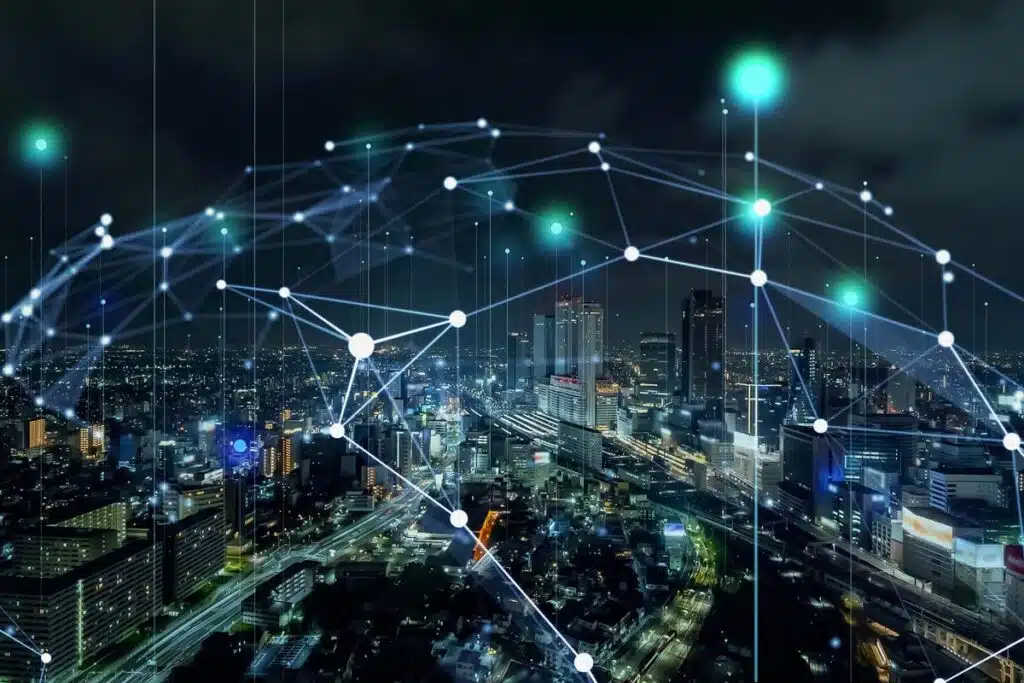 A cityscape at night with an internet connectivity grid overlay, representing FCC net neutrality restoration.