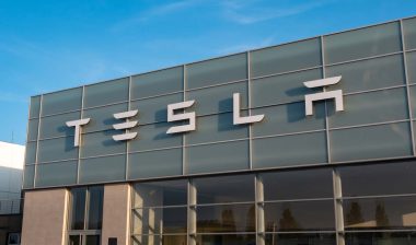 Close up of Tesla signage, representing the Tesla class action.