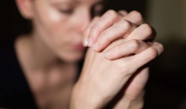 young woman praying Feeling desperate.