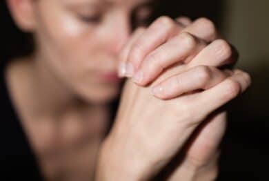 young woman praying Feeling desperate.