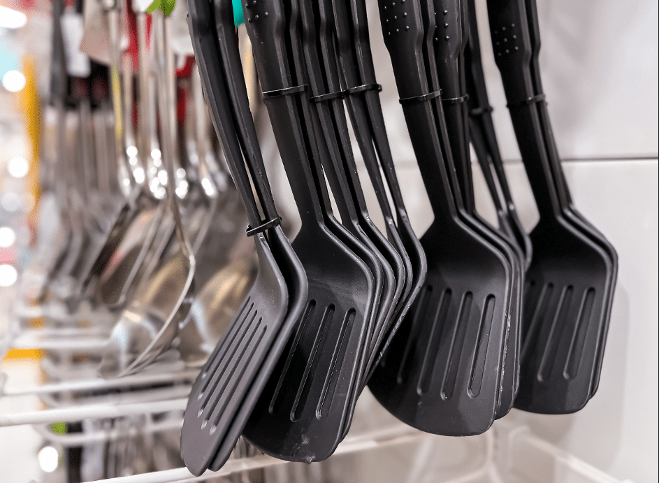 Spatulas hanging in grocery store.