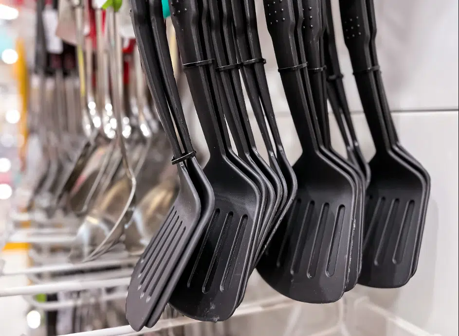 Spatulas hanging in grocery store.